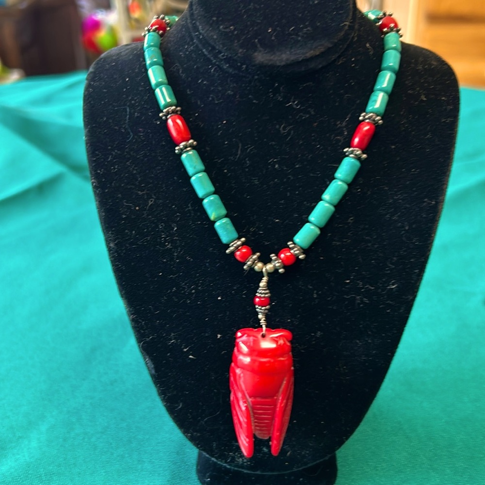One of a kind turquoise, sterling, and coral necklace.